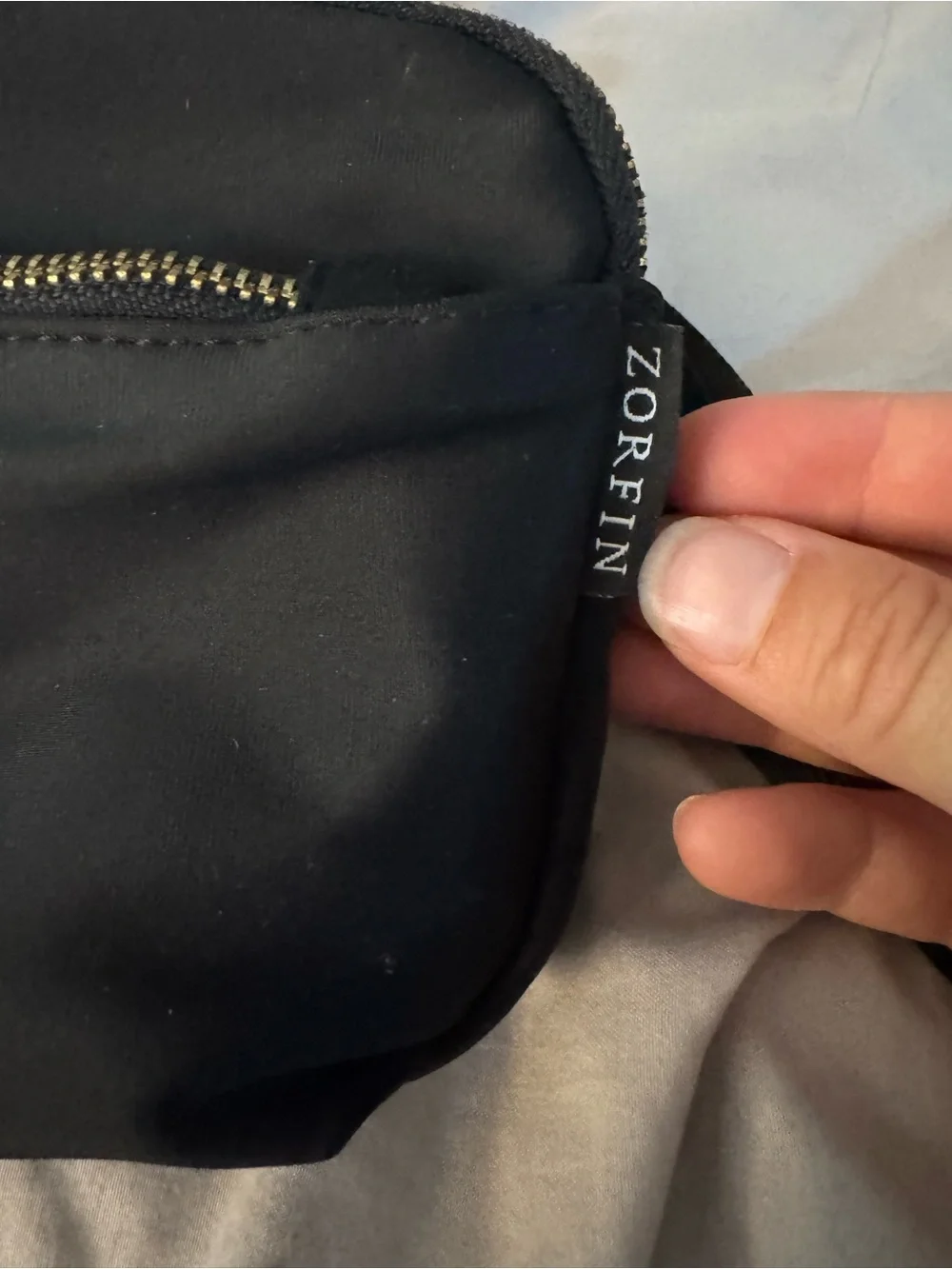 Black Crossbody Bag with Gold Zipper Pull by Zorfin
